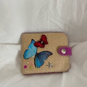 Super cute little wallet. Never used.